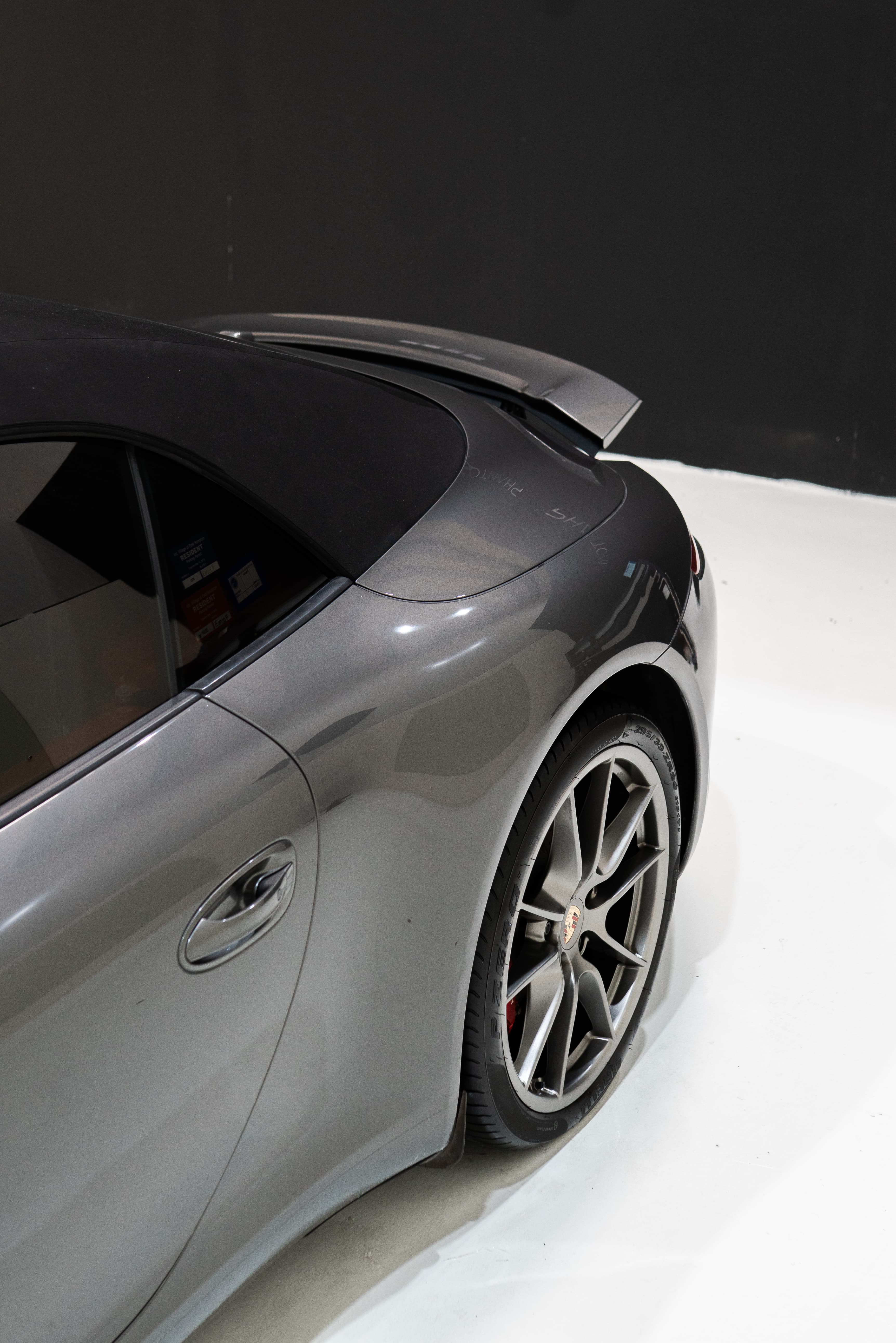 Porsche 911 Cabriolet rear 3/4 view showing deep mirror gloss after ceramic coating at ASV Phantom Dubai