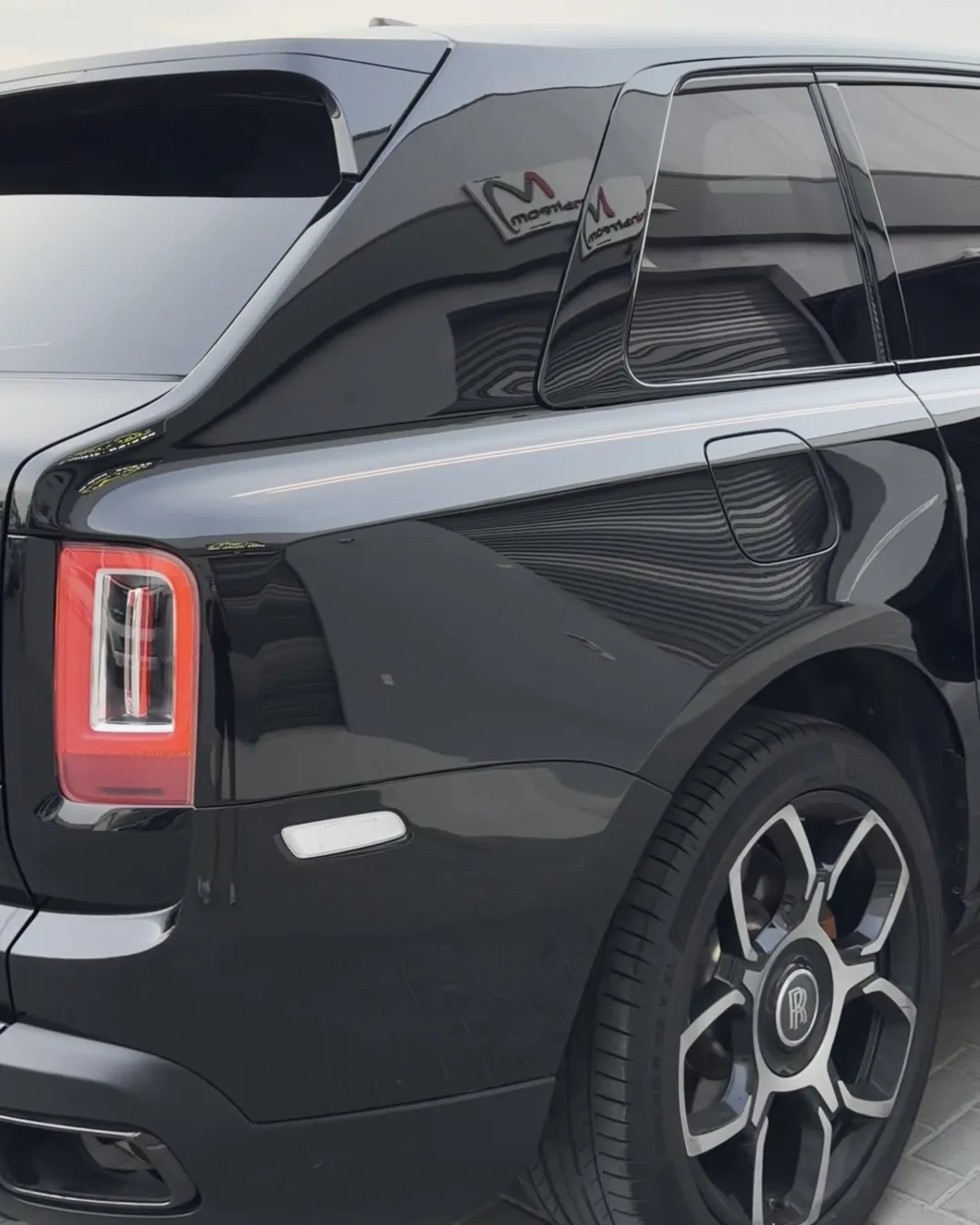 Rolls-Royce Cullinan rear glass after window tint, outdoors