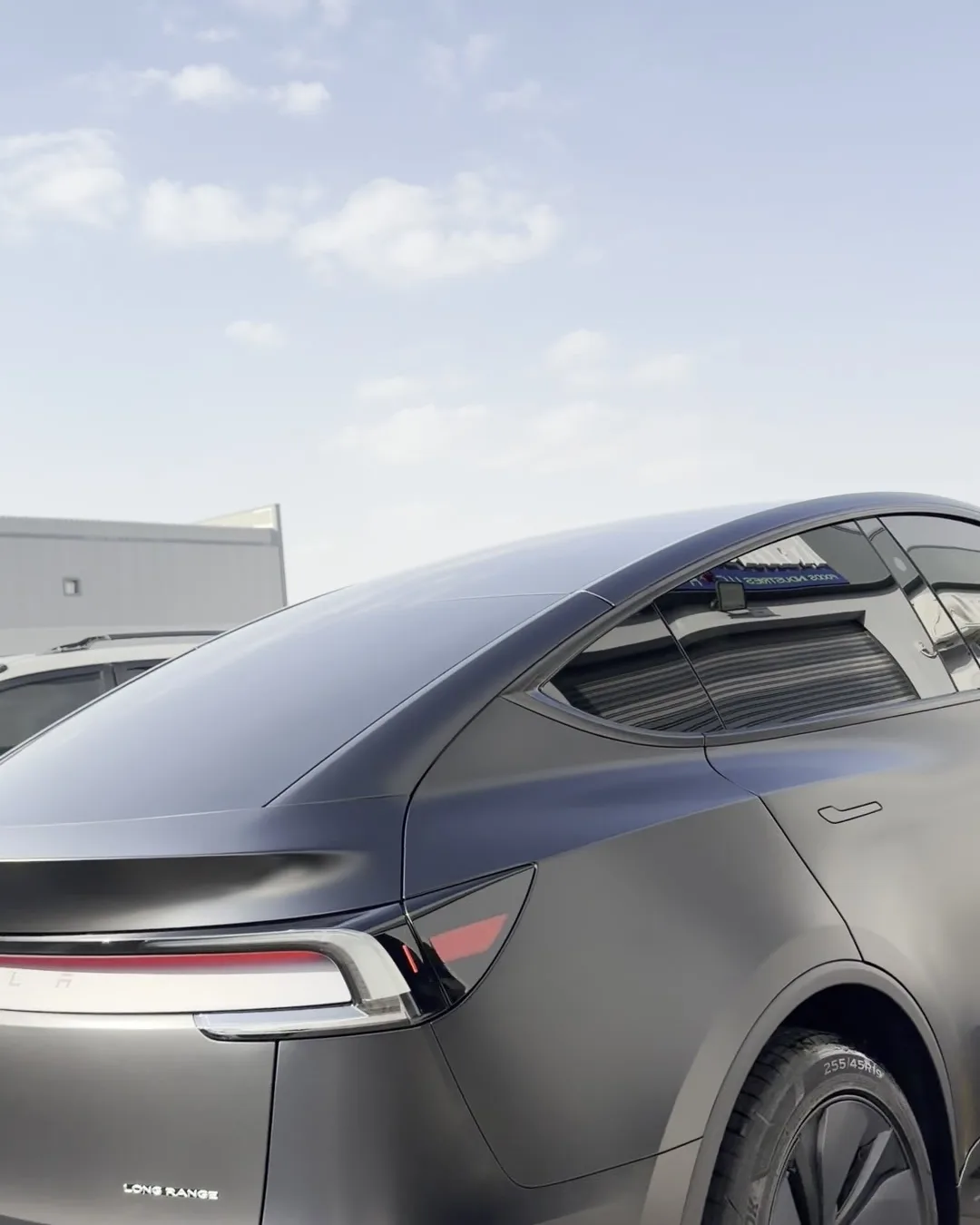 Tesla with tinted rear glass, outdoors