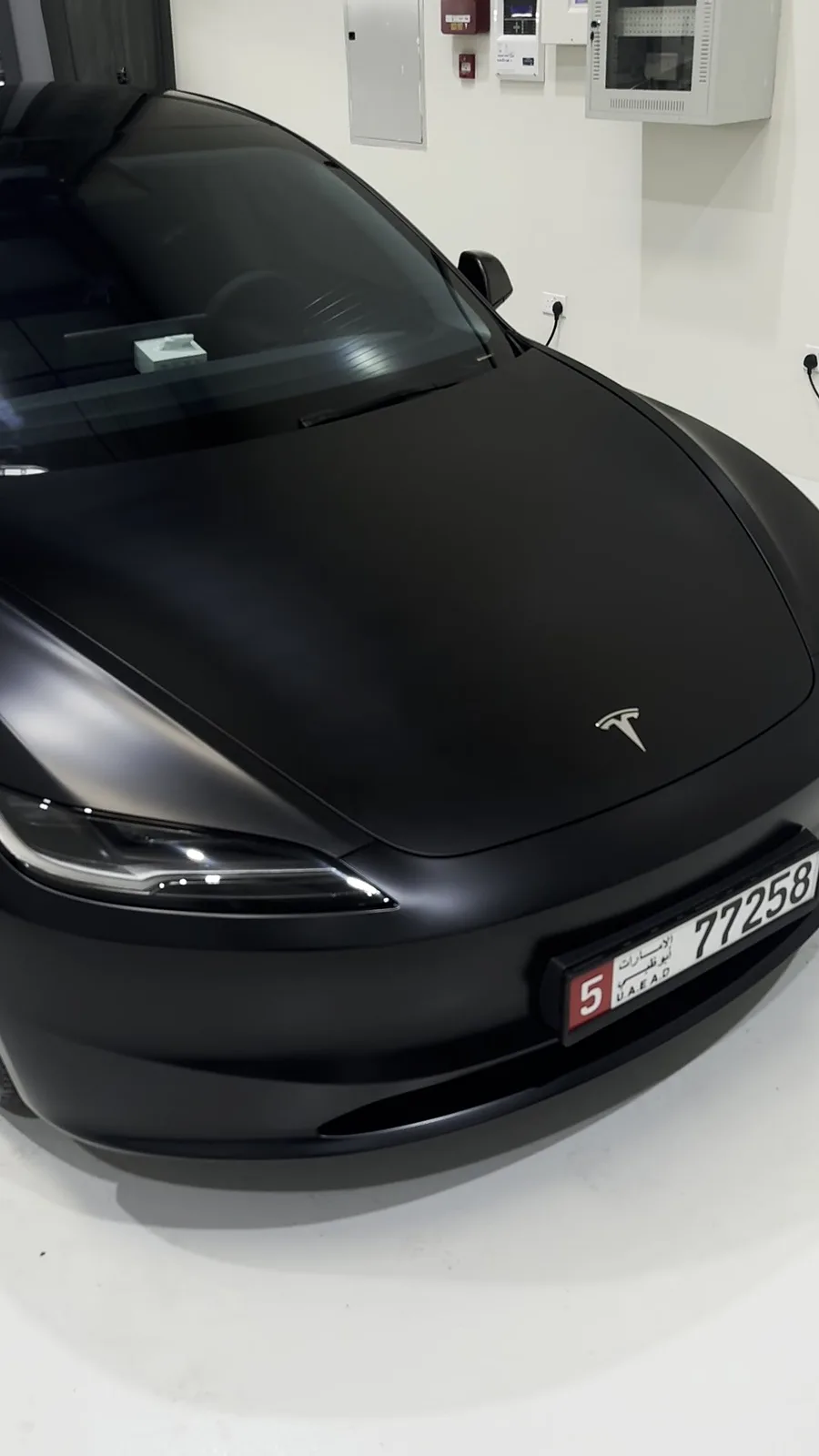 Tesla in matte black PPF, front view in the ASV studio